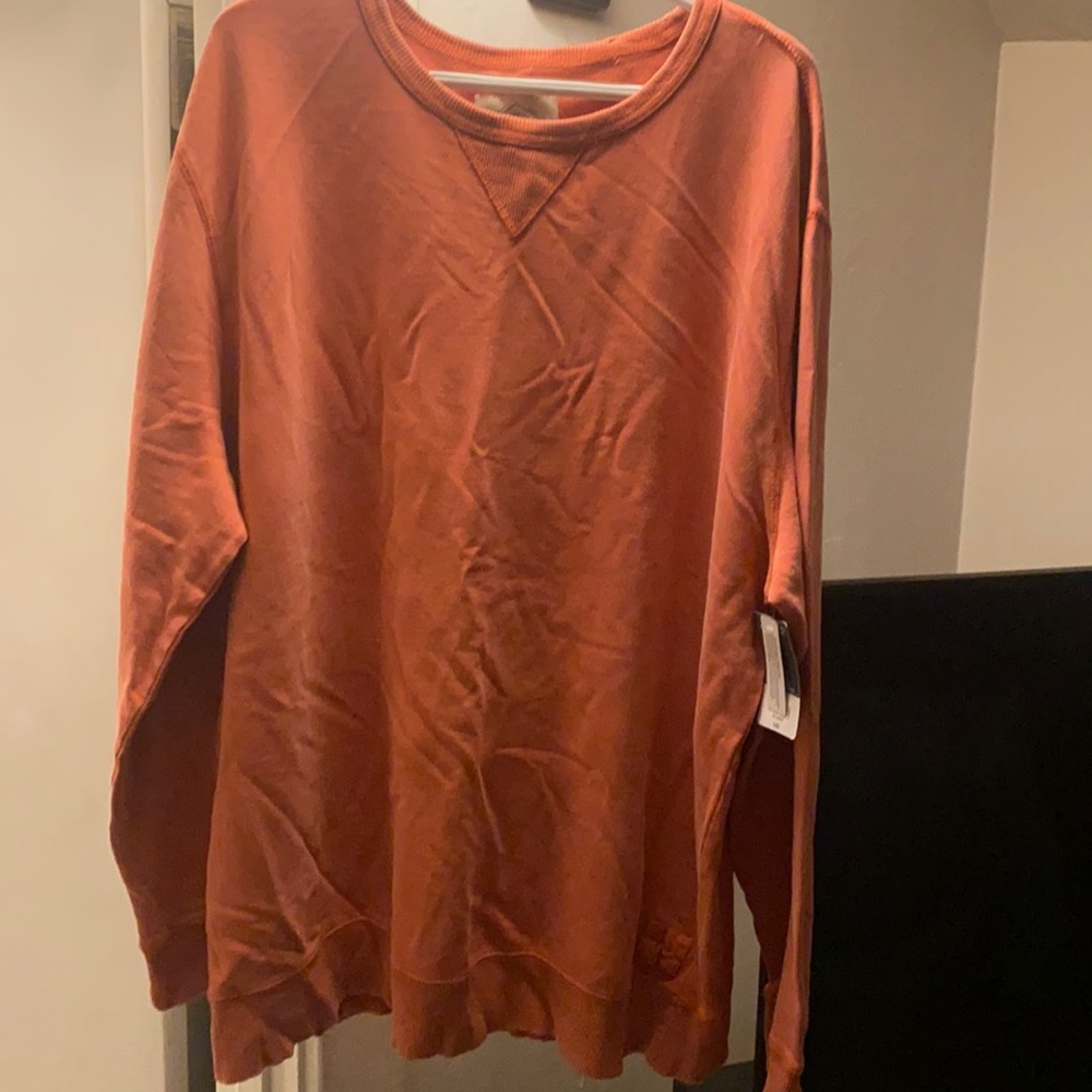 Never been worn. Dusty orange colored sweatshirt